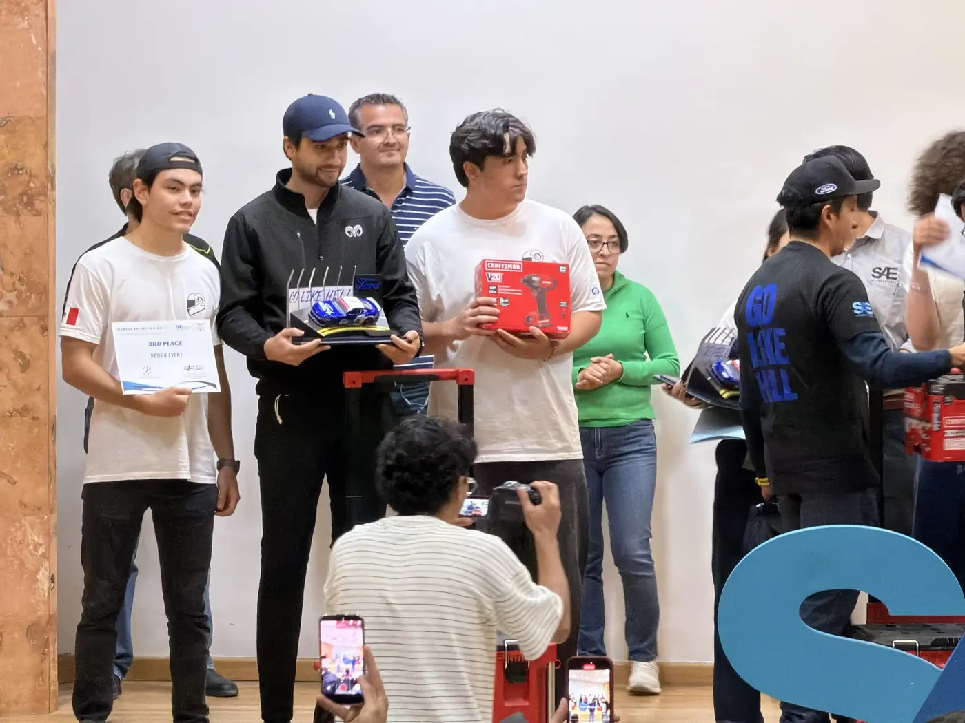 TEC Racing members receiving the third-place certificate for Design Overall
