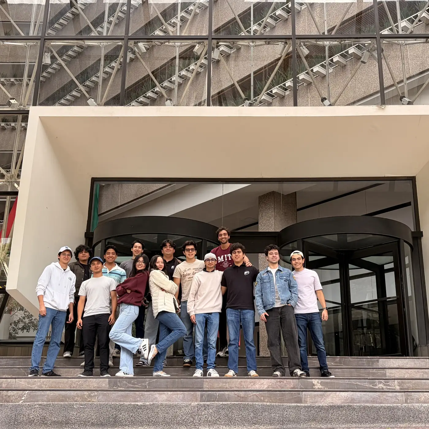 The team on the steps of the faculty building where the competition was held