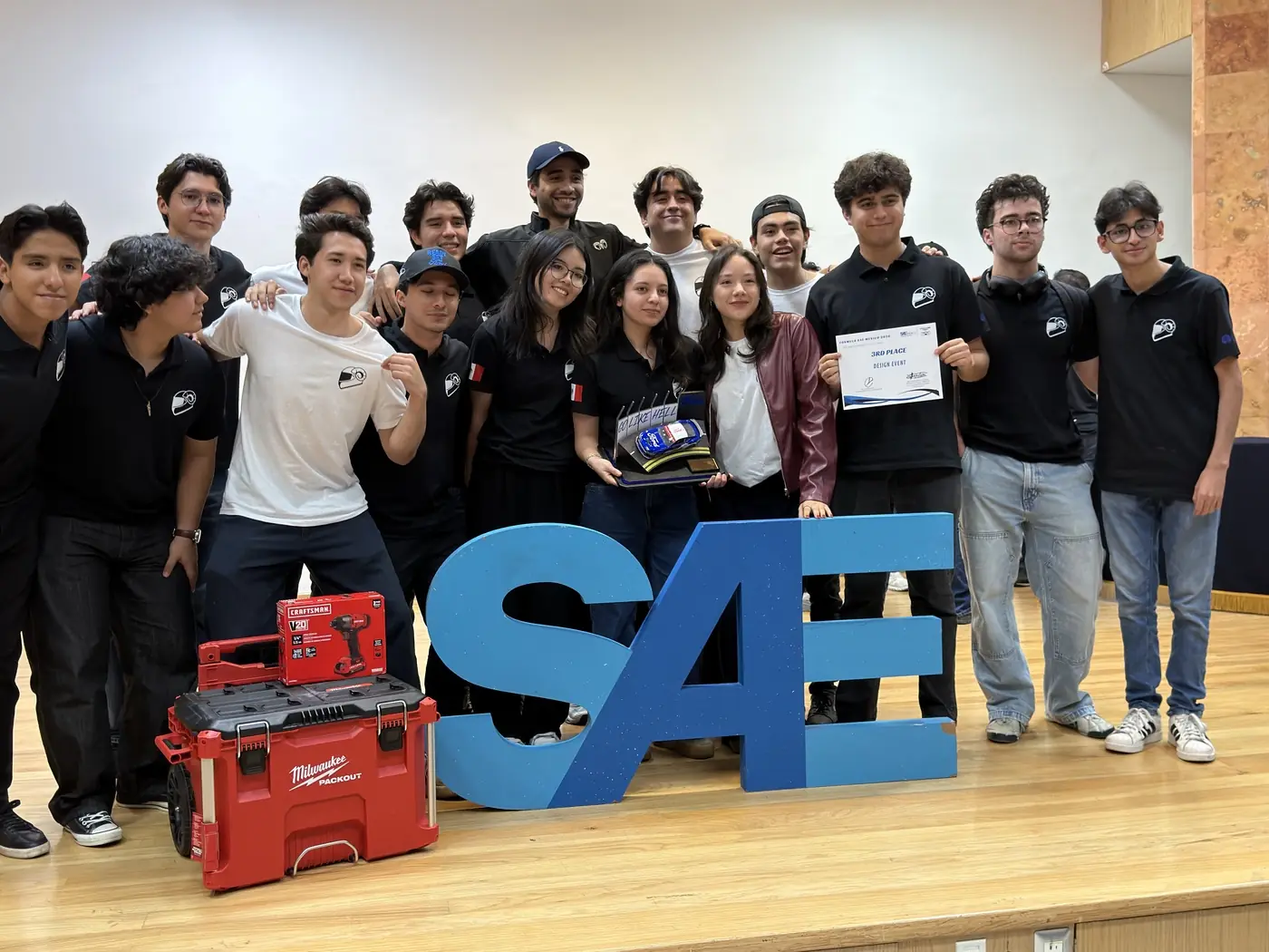 The TEC Racing team on stage with the third-place certificate for Design Overall at Formula SAE Mexico 2026